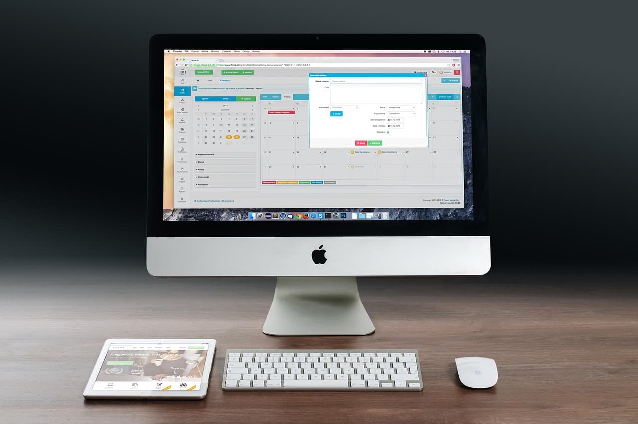 Computer monitor displaying a content calendar interface for YouTube channel planning.