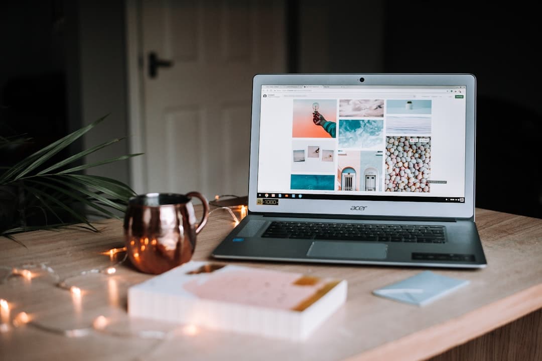 Faceless YouTube creator's desk with laptop displaying stock photos and a mug.