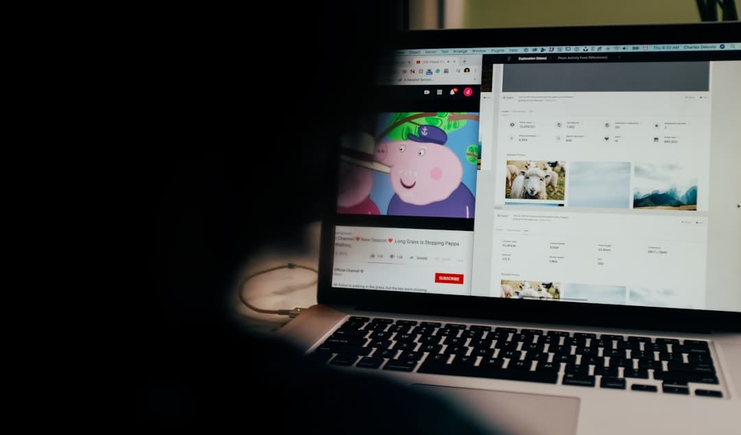 Laptop screen showing YouTube Studio analytics dashboard for content strategy and AI channel management.