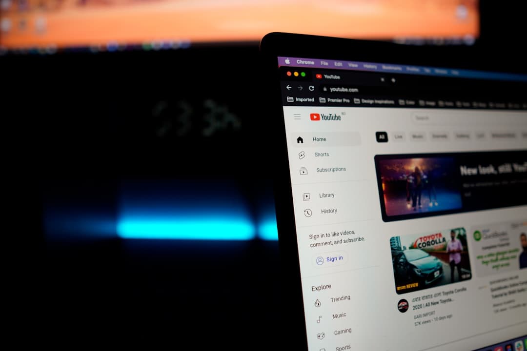 Laptop displaying YouTube homepage, relevant for faceless YouTube creator workflow and monetization updates.
