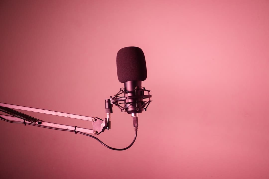 Faceless YouTube creator's studio microphone setup for batch production.
