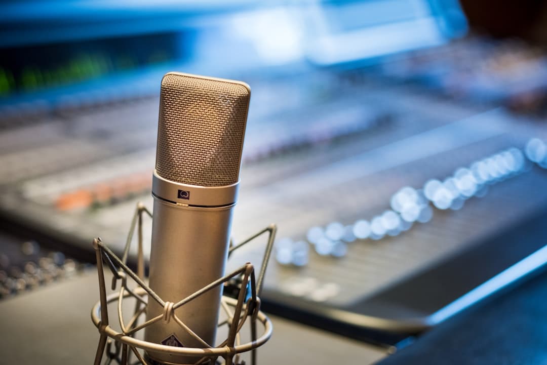 Close-up of a studio microphone on a soundboard, ideal for faceless YouTube creator audio setup.