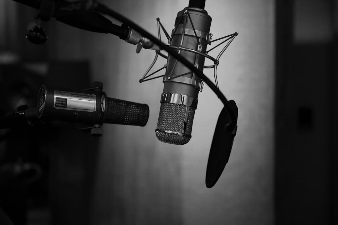 Microphone setup with pop filter and boom arm for faceless YouTube content creation workflow.