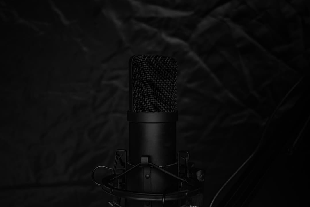 Close-up of a professional microphone on a stand, ideal for faceless YouTube creator audio setup.