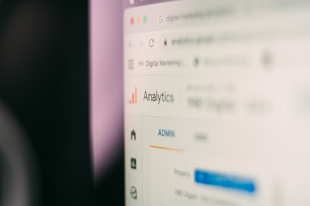 Close-up of a computer screen showing YouTube Analytics dashboard for a faceless creator.