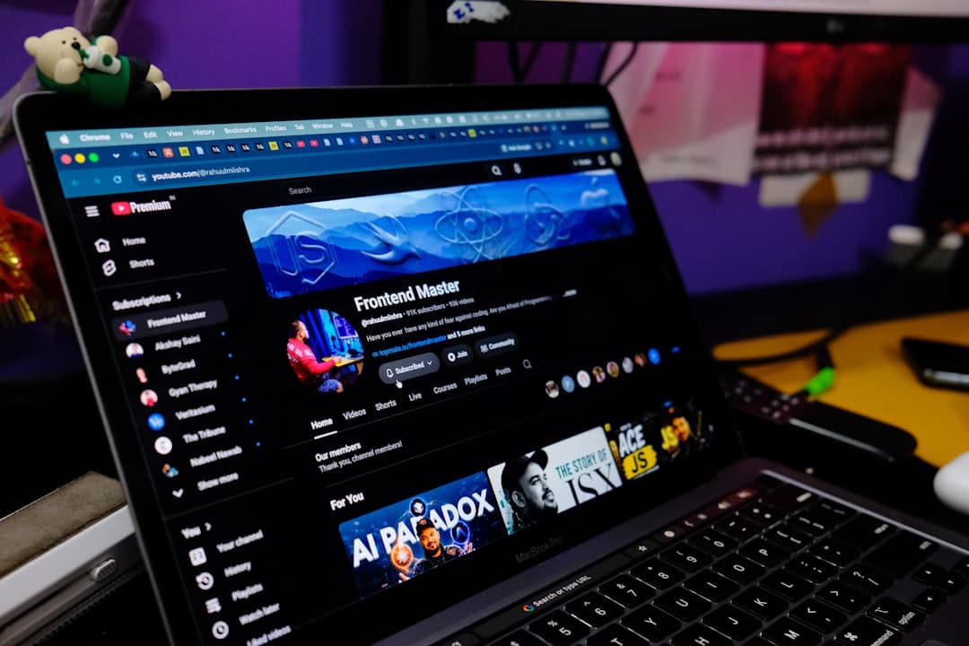 Laptop displaying YouTube Studio dashboard for faceless channel analytics and growth.