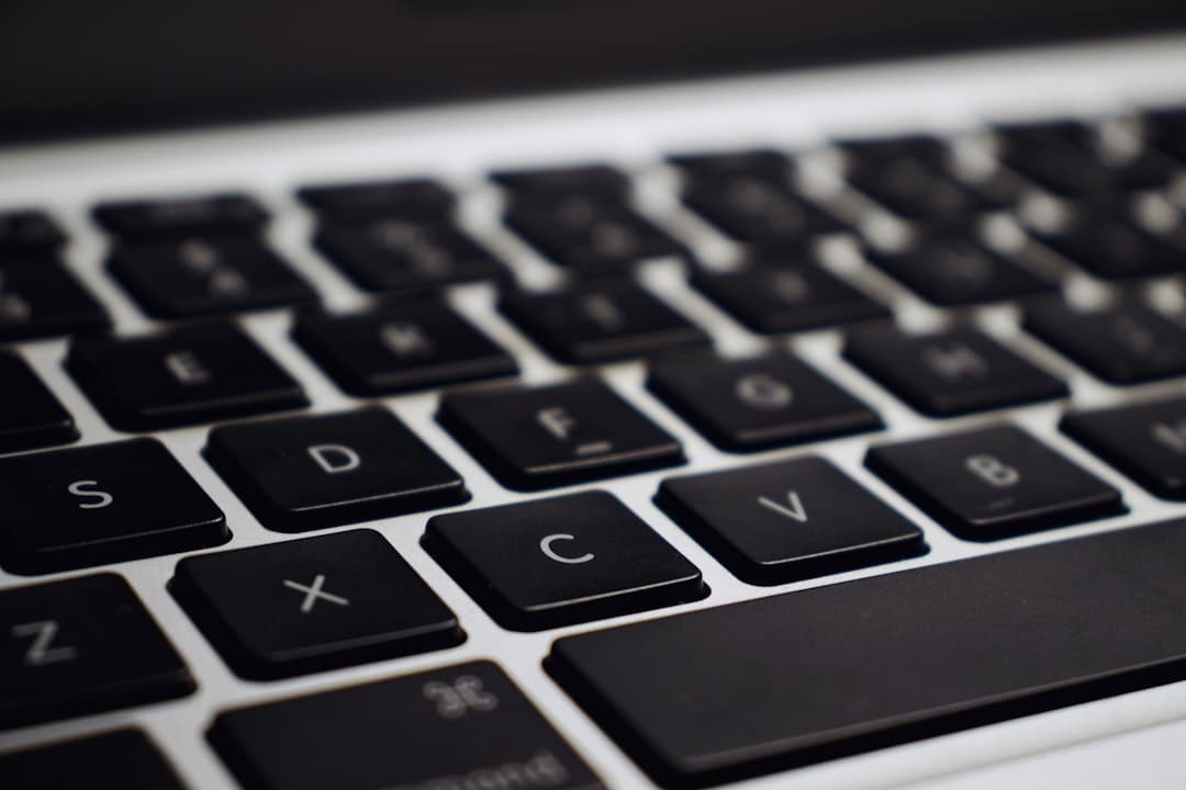 Close-up of a laptop keyboard, ideal for faceless YouTube creator workspace visuals.