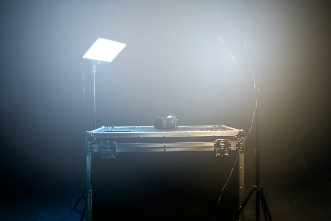 Camera and lighting equipment set up on a case for content creation, suggesting a faceless YouTube studio.