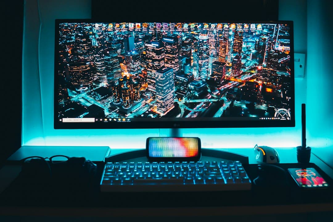Faceless YouTube creator's desk with multiple monitors displaying cityscapes and software interfaces.